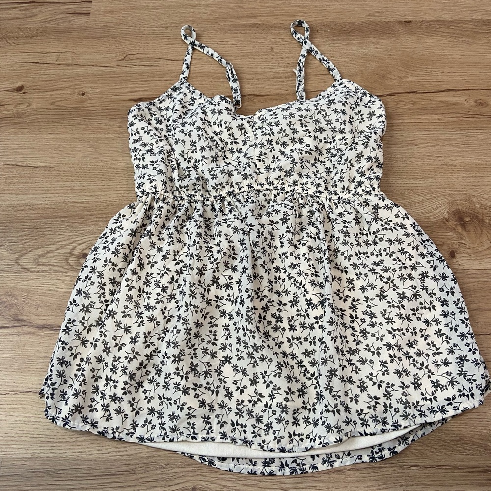Cute baby doll top with black flowers with tye back